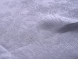an image of a close up of a bed with a white sheet