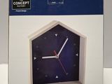 boxed picture of a clock with a blue face and red hands