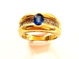 une image représentant une bague en or sertie d'un saphir et de diamants