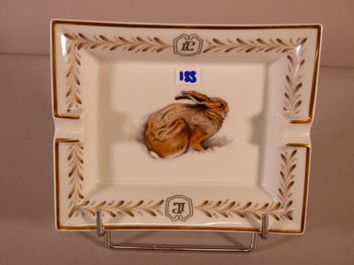 a small plate with a picture of a mouse on it