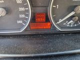a close up of a car dashboard with various gauges and numbers