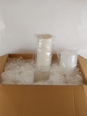a cardboard box filled with plastic cups and a cup holder