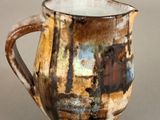 a close up of a coffee cup on a table