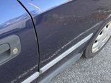 a close up of a car door handle and the door handle of the car
