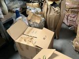 many boxes of plants in a room with a hat on top of them