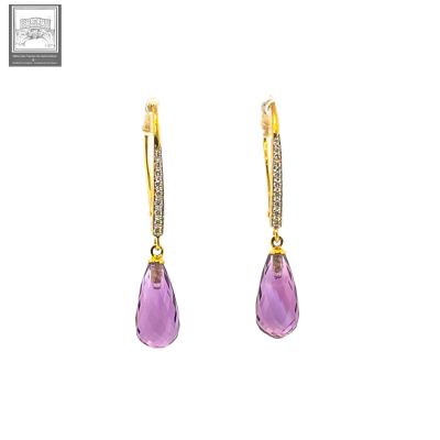 a pair of earrings with amethorate and diamonds on a white background