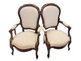 a pair of antique chairs with white upholstered upholstered seats