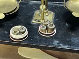 an image of a scale with a spoon and spoon rest on it