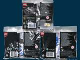 four bags of legos sitting on top of each other