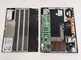 someone is removing the motherboard from the laptop and removing it