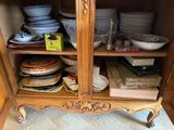 a cabinet with a lot of plates and bowls on it