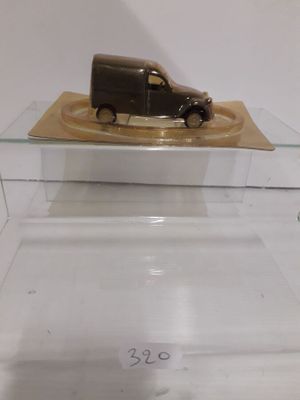 a small toy truck that is on display in a glass case