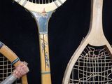 two tennis rackets that are sitting next to each other