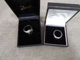 two rings in a black box on a table