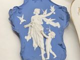 a blue plaque with a picture of a woman and a dog