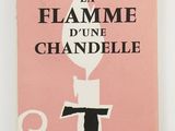 a pink book with a black and white image of a candle