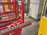 a machine that is working on a conveyor belt