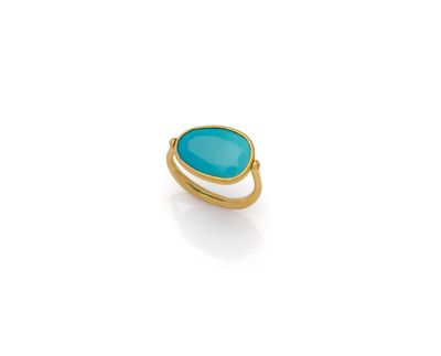 a gold ring with a turquoise stone in the middle