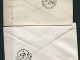three old envelopes with stamps on them sitting on a table