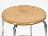 a small stool with a wooden seat on a white surface