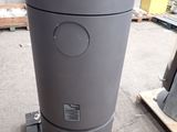 a trash can sitting on a pallet in a warehouse