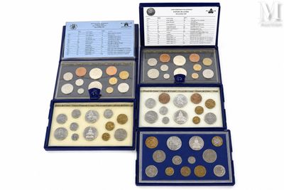 four different types of coins are in a display case