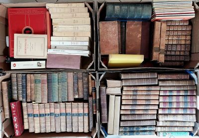 many boxes of books stacked on top of each other