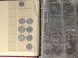 a lot of coins that are in a plastic box