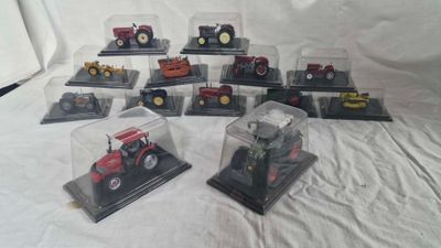a lot of different models of tractors in display cases