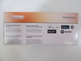 a white box with a red and orange label on it
