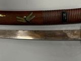 two knives that are on the wall next to each other