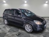 a picture of a black minivan parked in a garage