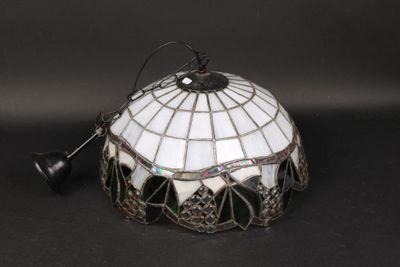 an image of a stained glass lamp shade on a black background
