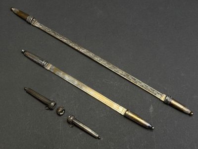 three different types of metal tools on a black surface