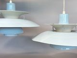 two lamps hanging from the ceiling of a room
