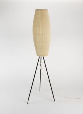 a wooden floor lamp with a black tripod base and a beige shade