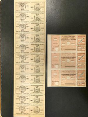 un vieux dossier noir sur lequel sont posés de nombreux papiers