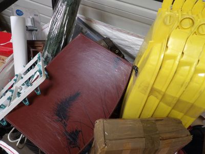 a pile of assorted items in a cluttered room