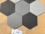 several hexagonal tiles are arranged on a table with a price tag