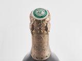 a close up of a bottle of wine on a table