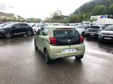 many cars parked in a parking lot in the rain