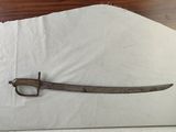 a picture of a sword that is laying on a piece of paper