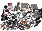 a pile of assorted watches and other items