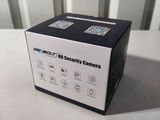 a close up of a box on a table with a camera in it