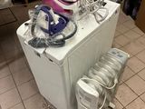 a small refrigerator with a bunch of appliances on top of it