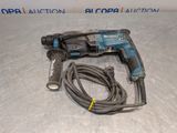 a close up of a corded drill with a cord attached to it
