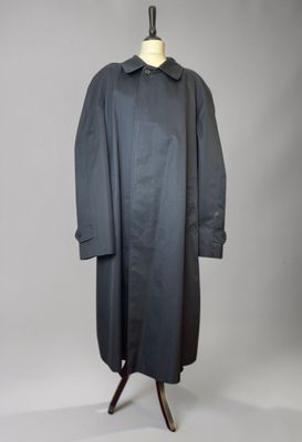 an image of a black coat on a mannequin mannequin stand