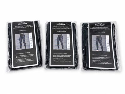 three pairs of men ' s pants are packaged in plastic bags