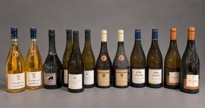 bottles of wine are lined up in a row on a table