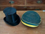 two hats that are sitting on top of a wooden table